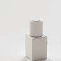 Luxurious Revitalizing Face Cream In Golden Bottle With Silver Cap Design