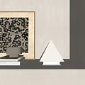 Modern Triangle Table Lamp on White Shelf with Stacked Books and Framed Decorative Painting