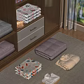 Folded Clothes In White Pink Beige With Leaf Patterns On Wooden Shelf And Carpet