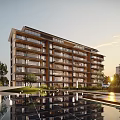 Modern Multi Storey Apartment Building With Balconies And Waterfront Landscaping
