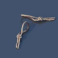 Decorative Twisted Knots With Shiny Metallic Finish Displayed On Dark Background