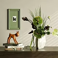 Decorative Tabletop Ornament Arrangement With Green Frame Deer Figurine Books White Vase And Lush Plants
