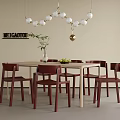Stylish Light Wood Table And Red Chairs Set With Hanging Pendant Lights And Potted Plant