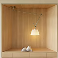 Modern Pendant Light Hanging Over Wooden Display Shelf With Open Book And Warm Lighting