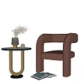 Modern Side Table With Vase Dried Flowers And Brown Chair Near Open Book