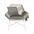 Stylish Rattan Leisure Chair With Metal Legs Gray Cushion Pillow And Draped Blanket