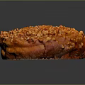 Golden Brown Round Pastry Topped with Crushed Nuts and Sweet Glaze