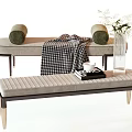 Light Gray Upholstered Sofa Bench With Plaid Blanket Wooden Legs And Glass Vase Decor