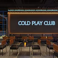 Modern Bar Interior With COLD PLAY CLUB Sign And Seating