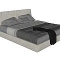 Modern Upholstered Double Bed With Gray White Bedding And Dark Blanket