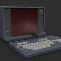 Vintage Commodore Portable Computer With Red Screen And Gray Keyboard