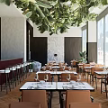 Elegant Restaurant Interior Design With Wooden Arched Walls Dining Tables And Green Plants