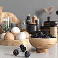 Modern Kitchen Utensils With Black Cookware Wooden Cutting Boards Cups Eggs Blueberries And Spice Jars