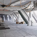 Industrial Workshop Interior Featuring Concrete Structures Exposed Pipes Boxes And Equipment