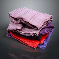 Stacked Colorful Textured Towels In Various Hues Purple Red And Blue