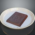 Decadent Chocolate Cake Served On Ornate White Plate With Gold Patterns