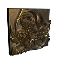 Intricate Carved Metallic Decor Featuring Floral Scrolls And Leaf Patterns