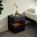 Modern Black Bedside Table With Decorative Vase Green Plant And Candles