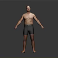 Shirtless Man Wearing Black Shorts Standing Barefoot Against Gray Background