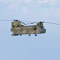 Military Green Twin Rotor Helicopter Flying In Blue Sky With Rotor Blades