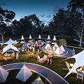 Aerial View of Illuminated Campsite With Multiple Tents RVs And Outdoor Gathering Areas