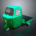 Green Three Wheeled Cargo Truck With Flatbed And Classic Vintage Design
