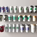 Assorted Coffee Cups Featuring Starbucks Branded Designs Colors And Lids 3d model
