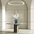 Modern Entryway Featuring Arched Design Circular Pendant Light Marble Top Table Blue Vase White Flowers