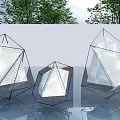 Three Geometric Metal Frame Sculptures With Mesh Design Outdoor Featuring Trees And Reflective Ground