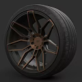 Car Tire With Bronze Alloy Wheel And Modern Spoke Design Features Black Rubber
