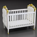 White Baby Crib With Gold Decorative Accents And Carved Headboard Design