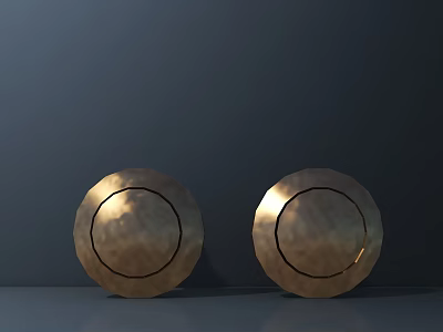 Pair Of Golden Round Metallic Objects With Hammered Texture On Dark Background 3d model