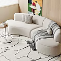 Beige Curved Sectional Sofa With Pillows And Striped Blanket On Area Rug With Wooden Wall