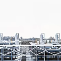 Large Industrial Factory Building With Metal Framework Multiple Exhaust Chimneys And Roof Structures