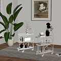 Black and Silver Rolling Storage Carts With Decorative Items In Indoor Living Space