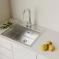 Stainless Steel Kitchen Sink with Modern Faucet Fresh Pears and Green Leaves on White Countertop