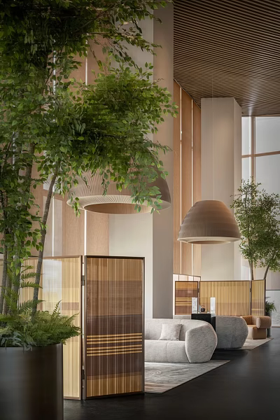 Modern Casual Lounge Area Featuring Green Plants Wooden Elements Pendant Lights and Screens 3d model