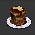 Stacked Pancakes Topped With Banana Slices And Chocolate Sauce On Blue White Plate