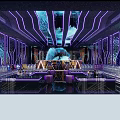 Modern KTV Interior Design With Purple Neon Lighting Central Decor And Seating Area