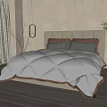 Serene Bedroom Interior With Tufted Headboard Quilted Comforter And Gray Brown Pillows
