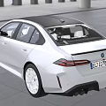 White BMW Sedan With Modern Headlights And Sleek Black Grille Design