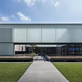 Contemporary Modern Building With Skylight Roof Glass Facade And Greenery