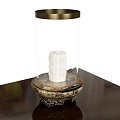 Elegant Candle Lamp With Transparent Glass Shade And Ornate Base Featuring White Candle
