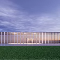Modern Building With Glass Curtain Wall At Dusk Overlooking Sea View