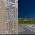 Illuminated Tower Beside Highway At Night With Trees And Moving Cars