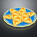 Yellow Triangular Pastries Arranged On Blue Decorative Plate For Snacks