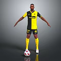 Man In Yellow And Black Football Jersey Standing With Outstretched Arms And Soccer Ball