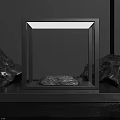 Illuminated Square Frame Display With Central Stone And Surrounding Rocks On Black Background 3d model