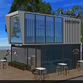 Container Cafe With Outdoor Wooden Deck Seating Umbrella And Green Plants On Lawn