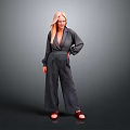 Blonde Woman in Gray Blazer and Wide Leg Pants with Brown Shoes Against Gray Background